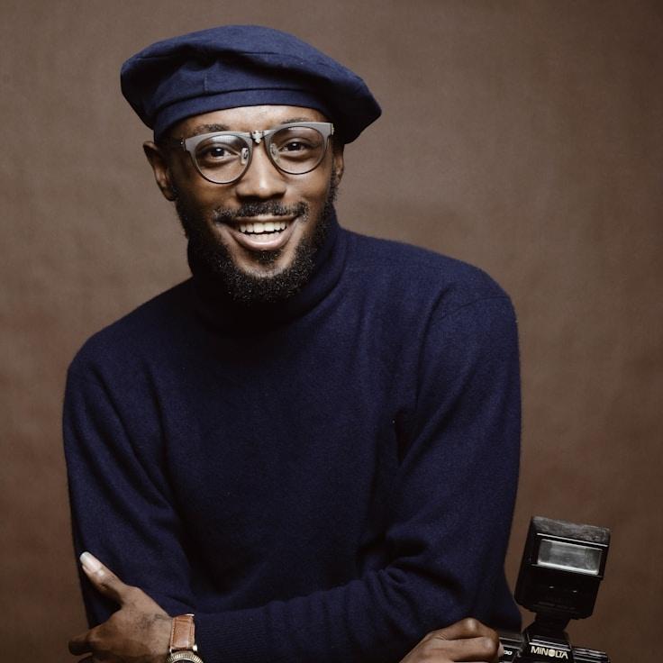 Alex Rivera, Lead Design Curator at AtlasLatticeWhisper, reviewing corporate floral arrangements